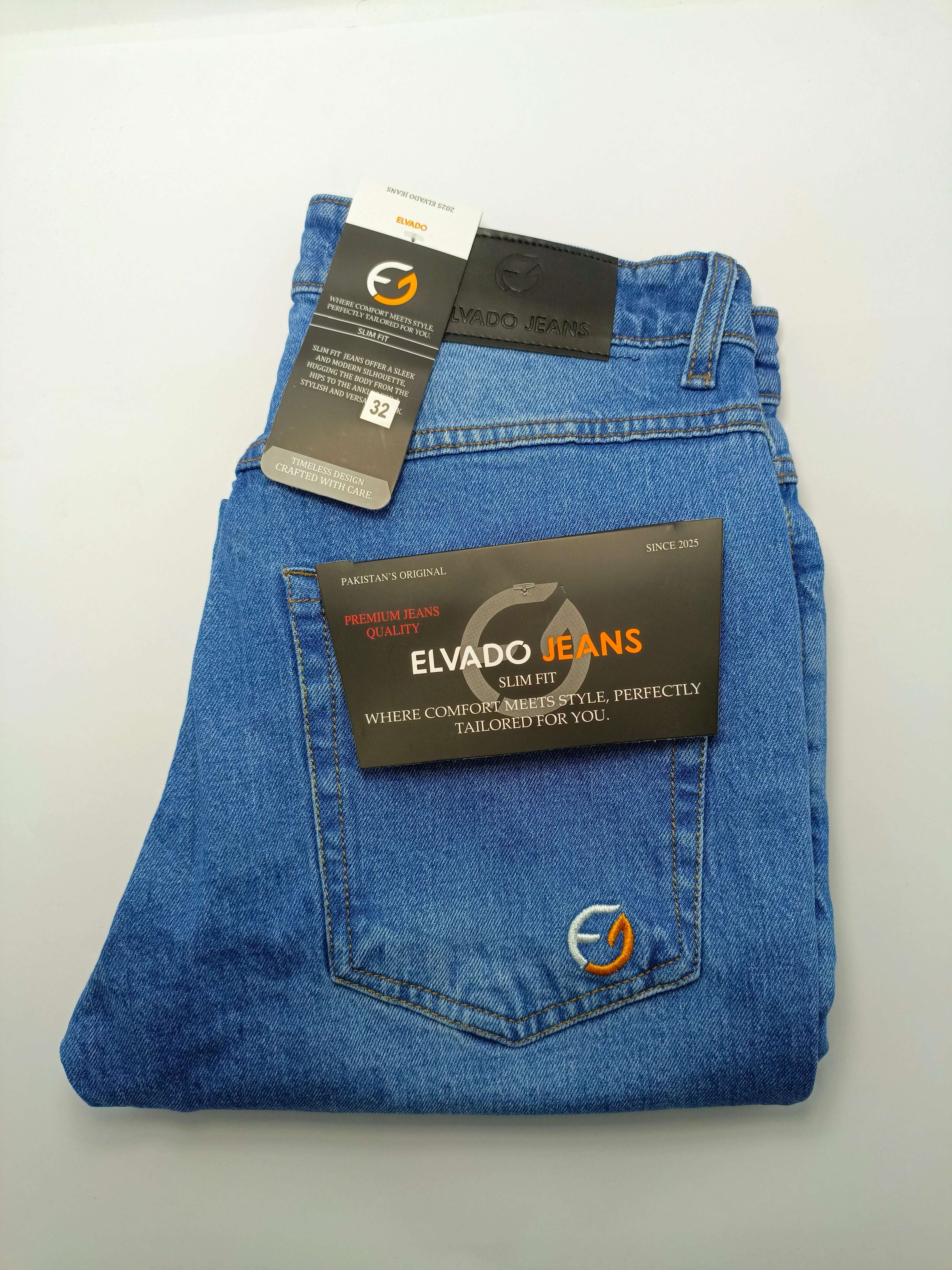 Medium Blue Denim – Elvado Jeans premium slim fit cotton jeans with tags laying flat.