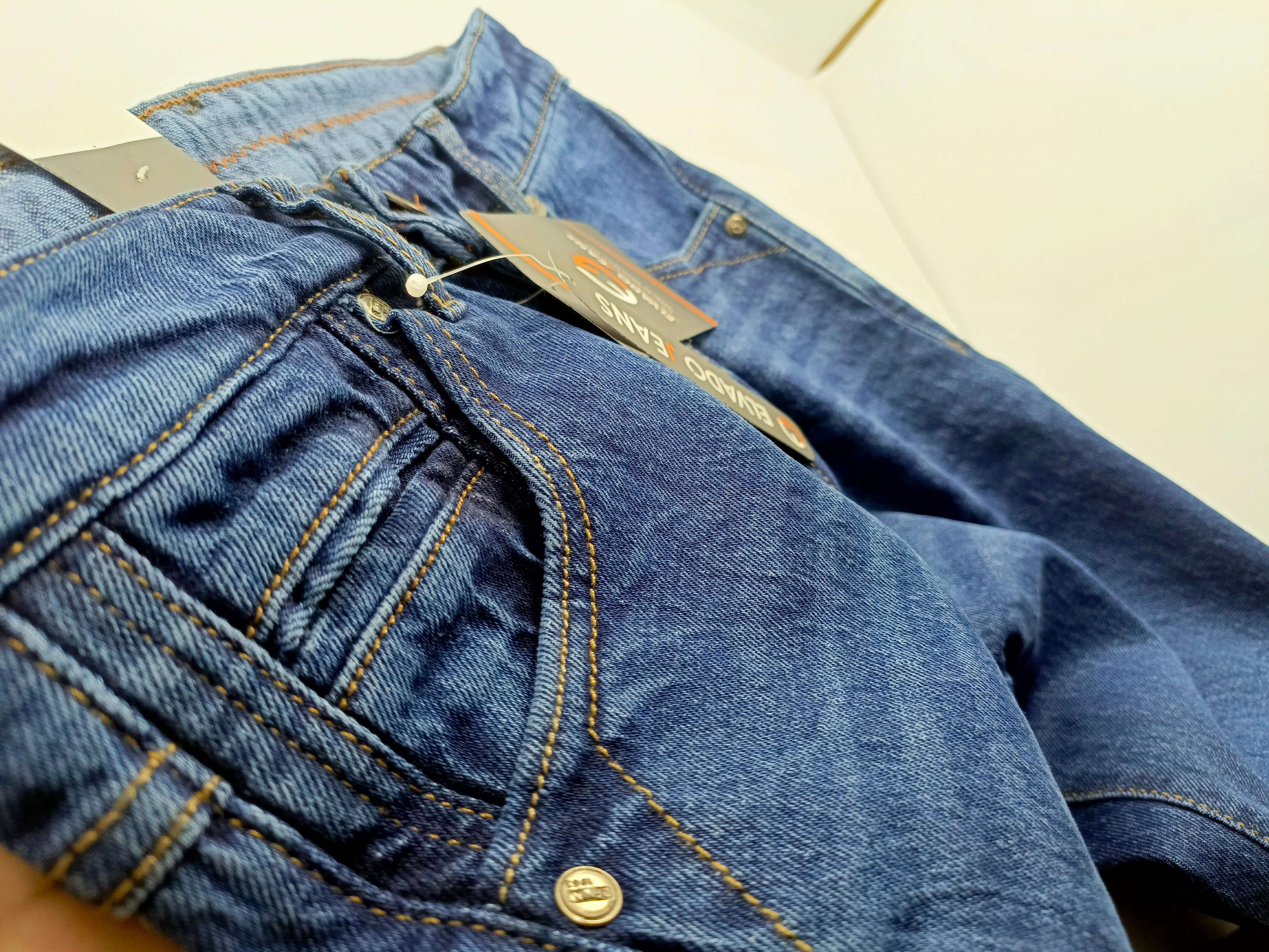 Close-up of Dark Blue Denim ELVADO jeans showcasing premium fabric and design details.