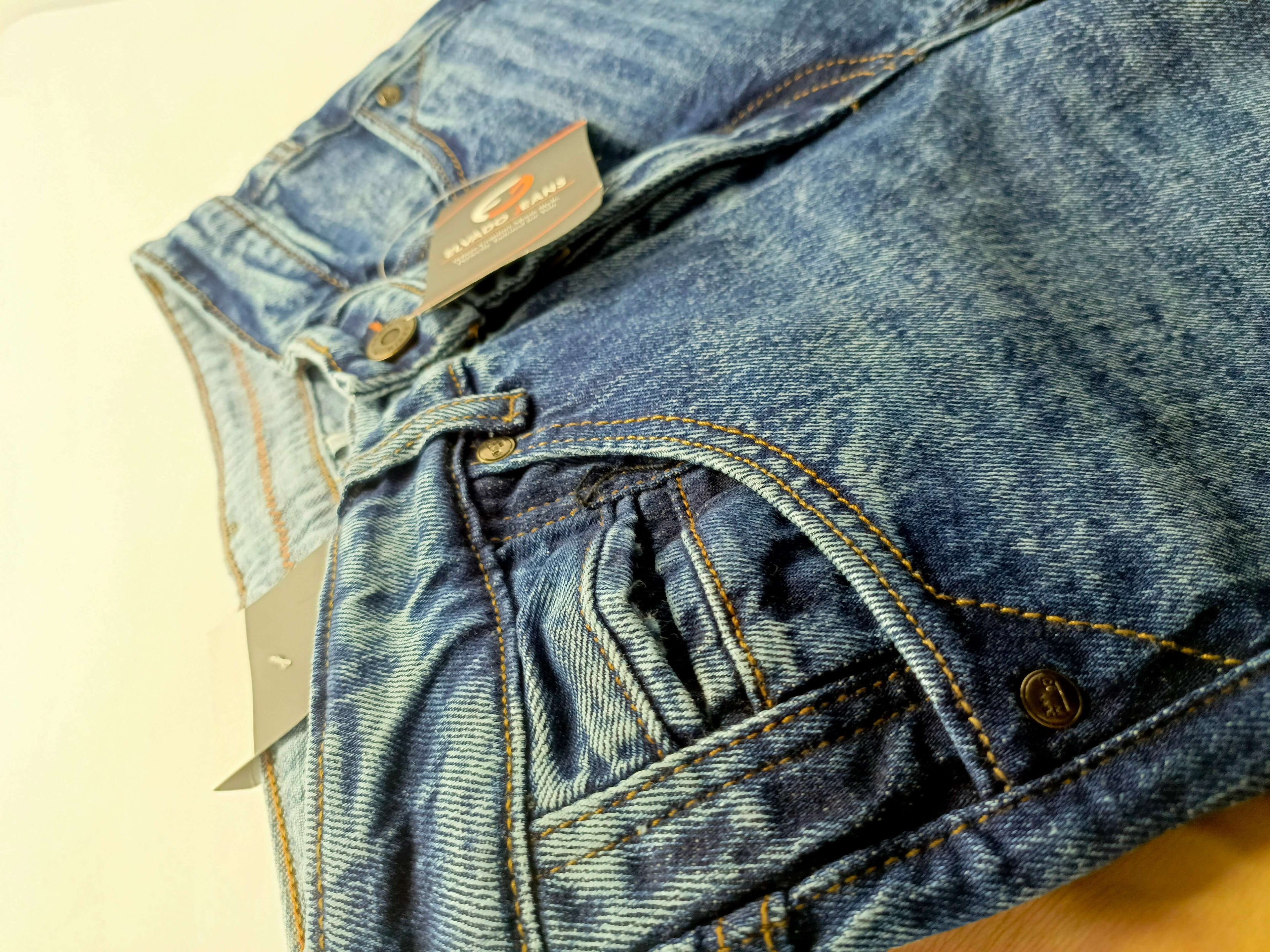 Dark indigo acid wash jeans showcasing slim fit design with high-quality stretchy cotton denim.